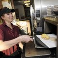 EXPANDED MENU - “Sandwich artist” Ashley Zimmerman prepares a breakfast sandwich Wednesday at Subway...