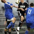Bentonville’s Tyler Jordan, center, goes up for a header against Harrison’s Hunter Rogers, left, dur...