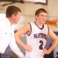  Fayetteville assistant coach Kyle Adams speaks with senior guard Jack Jones during the first half o...