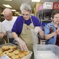 Karen Chambers, from right, Carolyn Ruhde, Richard Harris and Nita Nordgren package doughnuts donate...