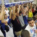 Rogers High School seniors cheer as a spirit stick is passed around the senior’s section during the ...