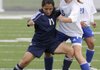 Meagan Johnson, right, Rogers High, fights for control of the ball against Springdale Har-Ber’s Lupe Lopez during a soccer match last season.