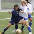 Meagan Johnson, right, Rogers High, fights for control of the ball against Springdale Har-Ber’s Lupe...