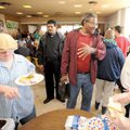  Merlin J. Augustine Jr., founder and chief executive officer of M&N Augustine Foundation, center, s...