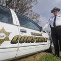  A.L. Hollingsworth of Springdale stands Friday next to his constable car. He’s been a Benton County...