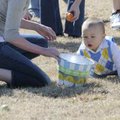  Parker James Kehrli, 1, crawls to his basket Saturday during the Mayor’s Easter Egg Hunt at The Chu...