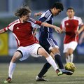  Rogers Heritage’s Diego Santillian battles for control of the ball with Fort Smith Southside’s Spen...