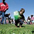  Davie Joe Hardin, 3, collects Easter Eggs with his father, Steve Hardin, on Saturday at the annual ...