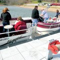 Passengers break out the lifejackets before a windy Easter family reunion cruise Sunday on Beaver La...