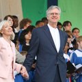 First lady Ginger Beebe and Rev. Vic Nixon hold hands during the Benediction for the Easter Sunrise ...