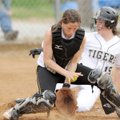 Prairie Grove catcher Judi Nichols, left, tries to control a throw to the plate as Bentonville’s Lau...