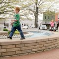 Jo Ellyn Bach, right, plays Tuesday with grandchildren Joseph Bach, 5, left, and Jessica Bach, 5, on...