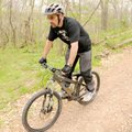 James Dorsey negotiates a downhill section Tuesday of the Slaughter Pen Mountain Bike Trail in Bento...