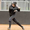 Bentonville’s Meg McGuirt leans in to make a base hit during the first inning of Tuesday’s doublehea...