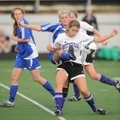 Rogers High’s Adrian Rogers, center, and Fayetteville’s Audrey Thorn fight for the ball during the s...