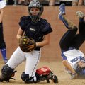 Rogers Heritage catcher Kaitlyn Tumey, left, checks runners in the infield as Rogers’ Alex Cook roll...