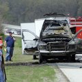 Crews with the Tontitown Area Fire Department clean up the scene of a truck fire on U.S. 412 west of...