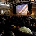  
Visitors listen as Daniel Martinez, 18, of Rogers speaks Wednesday in support of immigration refo...