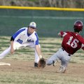 Rogers High’s Jason Carmichael reaches for the throw to second base as Springdale’s Cory Ponce slide...