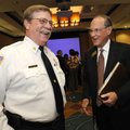 Bentonville Mayor Bob McCaslin, right, shares a laugh Wednesday with Fire Chief Dan White following ...