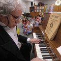 Mark Smidt of Fayetteville plays the piano Wednesday as Amadeus Mozart at Asbell Elementary School i...