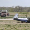 Firefighters respond to a plane off the runway Wednesday at the Rogers Municipal Airport. No one was...