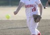 Farmington’s Katy Chavis delivers a pitch against Springdale High on March 29 in Springdale.