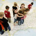 Sean Ryan’s first grade physical education class plays a game of Simon Says Wednesday on a National ...