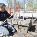 ROCK ON - Shay Mayes, left, and Justin Barnett, both with Mayes Masonry of Fayetteville, lay rock Th...