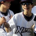C.J. Taylor, 12, laughs with his friends as they enter Arvest Ballpark on Thursday in Springdale on ...