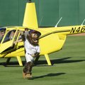 Strike, the Northwest Arkansas Naturals mascot, waves to fans Thursday after landing on the Arvest B...