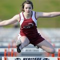 Springdale High’s Sarah Chewning clears the final hurdle while competing in the girls 100-meter hurd...