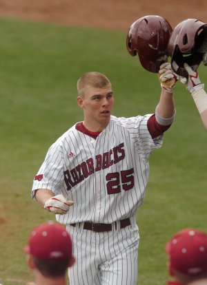 University of Arkansas Collin Kuhn celebrates after hitting a home run in the 3rd inning of the game March 13, 2010 at Baum Stadium in Fayetteville.