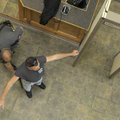  Sheriff’s Deputy Hunter Ayre, left, uses a metal-detecting wand to check Kelly Reid for weapons Thu...