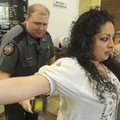  Evelyn Landaverde, right, spreads her arms as Sheriff’s Deputy Hunter Ayre performs a routine check...