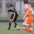  Bentonville’s Brian Flores pushes the ball upfield Friday against Rogers Heritage in Bentonville.