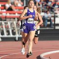  Elkins senior Grace Heymsfield leads the field in the 1,600 meters on her way to winning the race F...