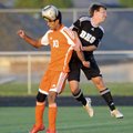  Rogers Heritage’s Alexy Silva, left, and Bentonville’s Colton Seyfarth battle for the ball Friday d...