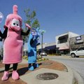  Katie Arth, left, and Savannah Bikoff dress as condoms and hold signs Friday encouraging people to ...