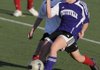 Fayetteville sophomore Lindsay Borderlon, right, kicks for a goal as Springdale High’s Brittany Jergan defends in the first half Friday in Springdale.