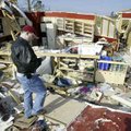  Mykel Stephens walks through the remains of his tornadodamaged home on March 13, 2006, at the inter...