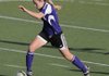  Fayetteville junior Anne Mitchell sprints upfield against Springdale High on Friday in Jarrell Williams Bulldog Stadium in Springdale.
