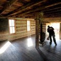  Jim Harmon of Fayetteville sweeps out a historic schoolhouse Saturday during the annual Park Day at...