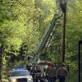  A repair crew from Ozarks Electric Cooperative Corporation work to restore power May 2, 2008, to re...