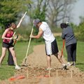Cobblestone Project volunteers (from right) Raigon Copeland of Rogers, and Josh Mapili and Erica Dur...