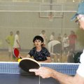  William Chambers, 10, plays a game of table tennis with his father, James, on Wednesday at the Jone...
