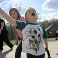  Ben Clarke, 2, plays with his sisters, Audrey, 11, right, and Grace, 8, after arriving home Wednesd...