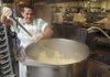  Trusty Mike Duffy stirs a pot of pasta Friday at the Benton County Jail. Food costs are one of the factors jail officials must consider when establishing fees for holding prisoners in the facility.