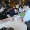 Carter Lankford, 15, left, and Jesse Colwell, 14, right, visit Thursday while Kayla Close, 16, cente...