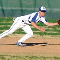 Rogers High’s Andy Couture reaches for a ground ball during Wednesday’s game against Springdale High...